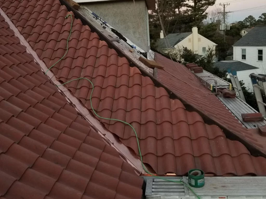 Repairing spanish style tile roof.