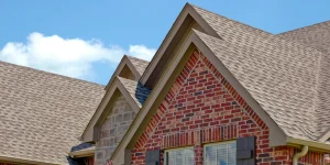 Architectural asphalt shingles on Virginia home with brick gables and multiple roof planes