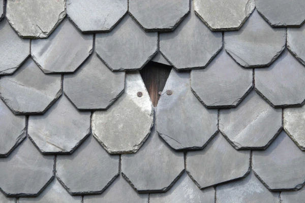 Missing slate roof tile, showing underlayment beneath